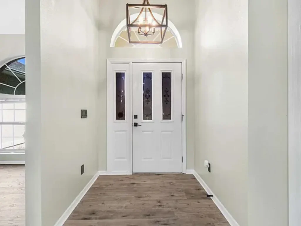 Behind Gate View of Modern Finishes and Fenced Yard in Central Ocala