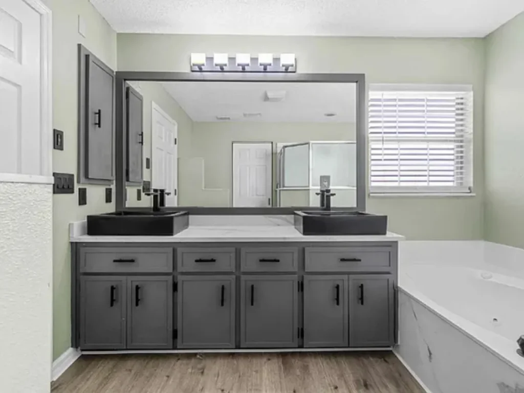 bathtub area with washbasin in Modern Finishes and Fenced Yard in Central Ocala